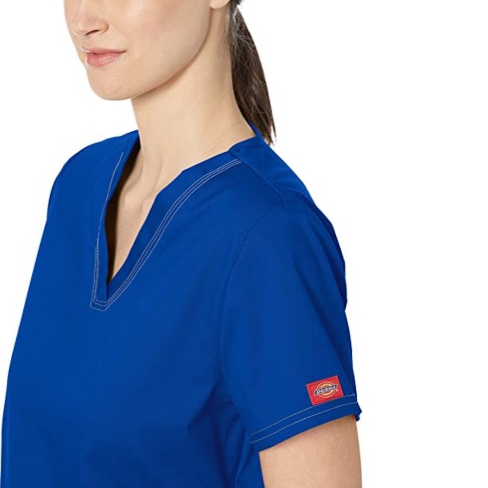 Dickies blue two pocket scrub top.